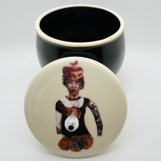 Black can with collage
