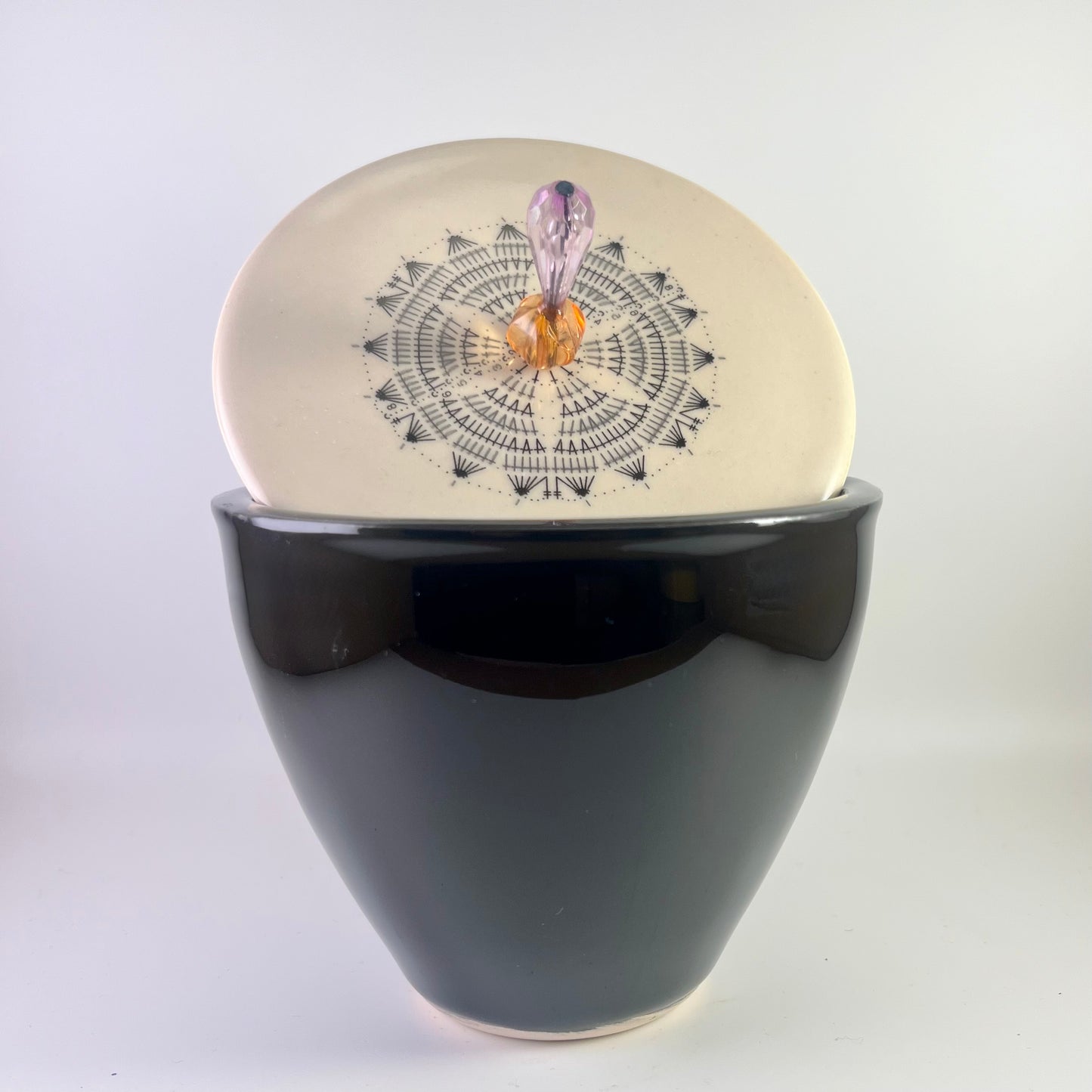 Black tin with ornamental lid