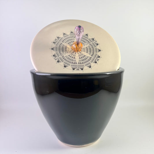 Black tin with ornamental lid